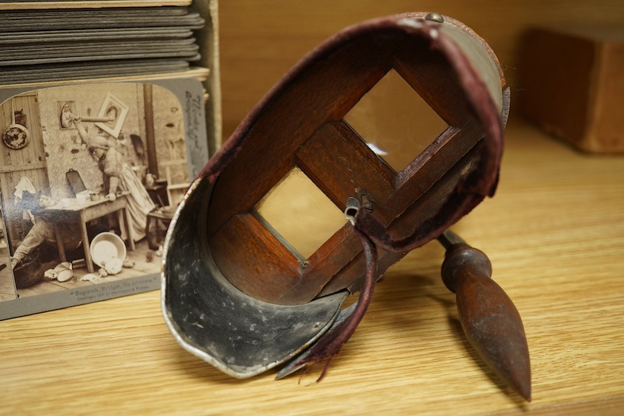 A stereoscope viewer with a collection of comical viewing cards. Condition - cards - fair/good, viewer - poor